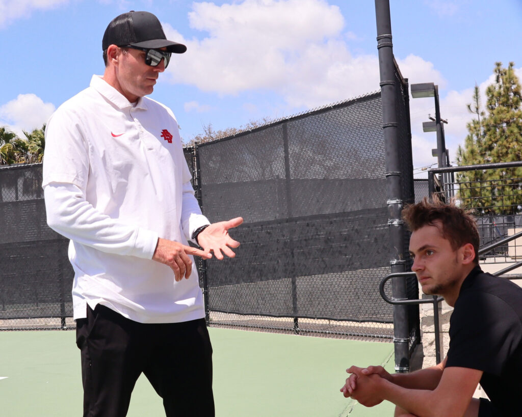 Aztec Associate Men's Coach Jeff Thomsen and Aztec Philipp Bosse